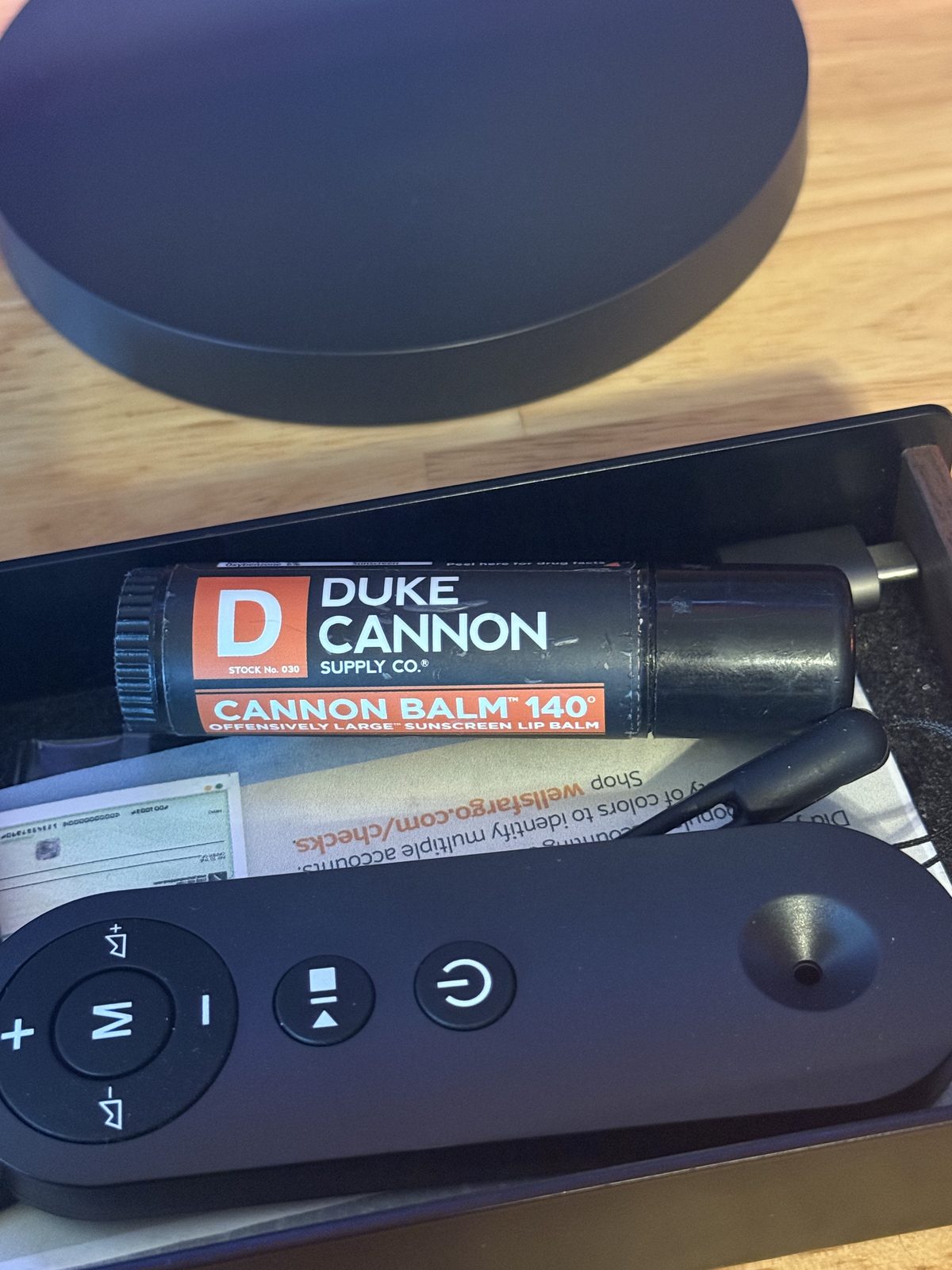 A Cannon Balm 140 tube sitting in the desk drawer