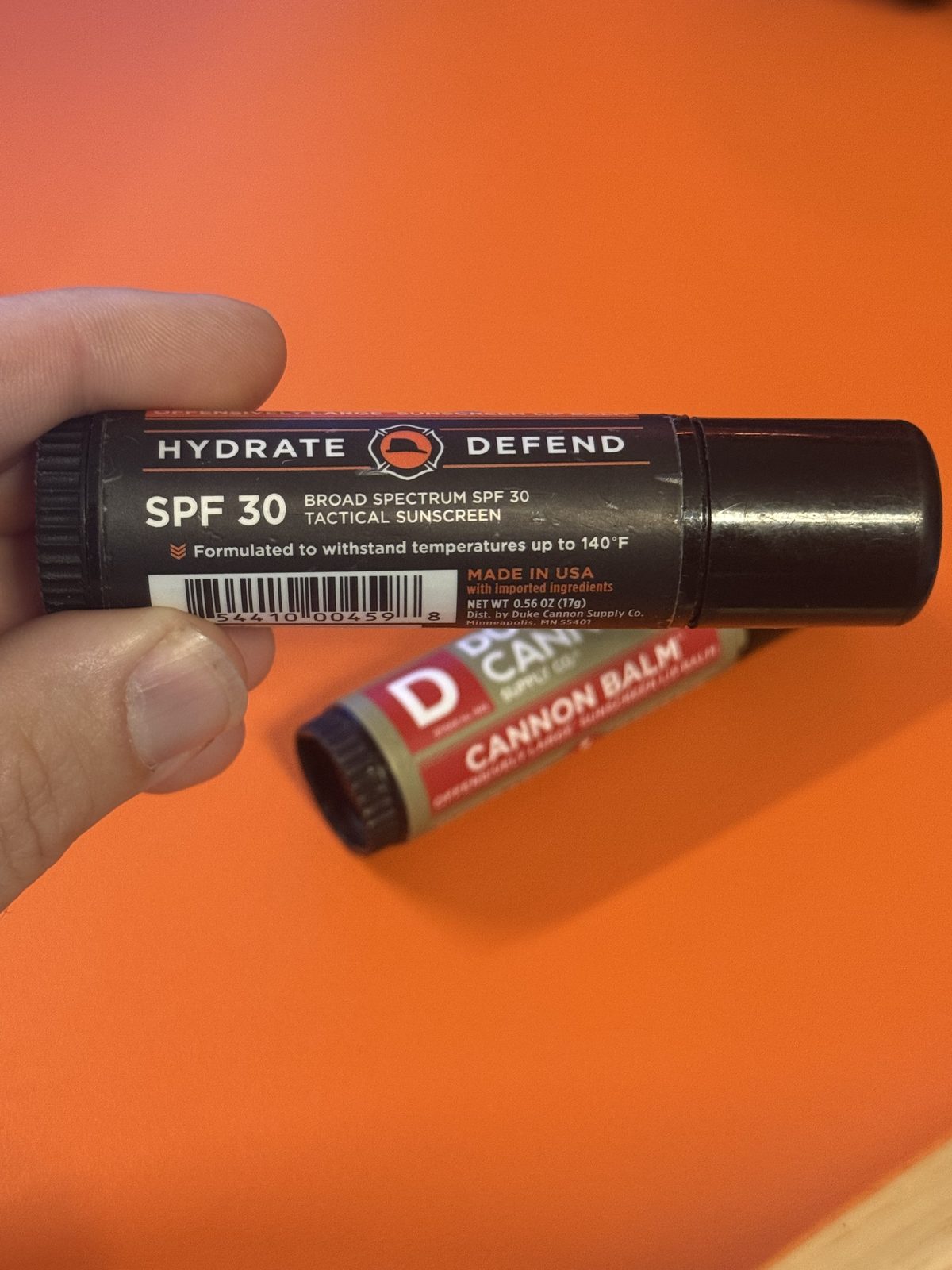The Cannon Balm 140 label showing SPF 30 and the offensively large sunscreen lip balm line