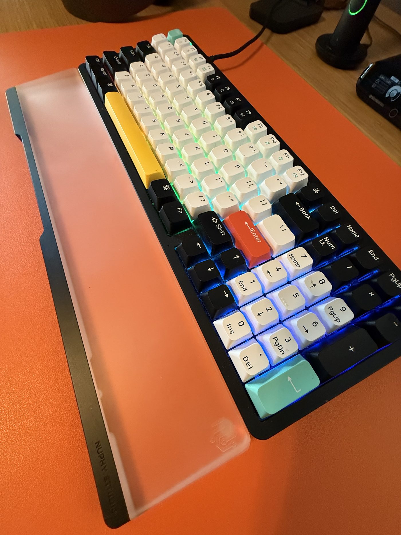 The original black Halo96 with the NuPhy Studio acrylic wrist rest: yellow spacebar, red Enter, no apologies