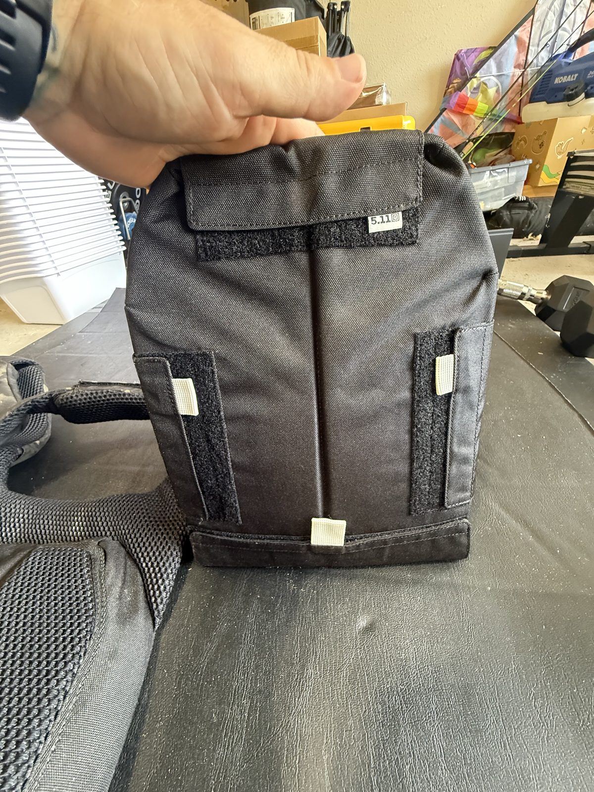 Sliding a sand-filled plate into the front of the TacTec Trainer vest