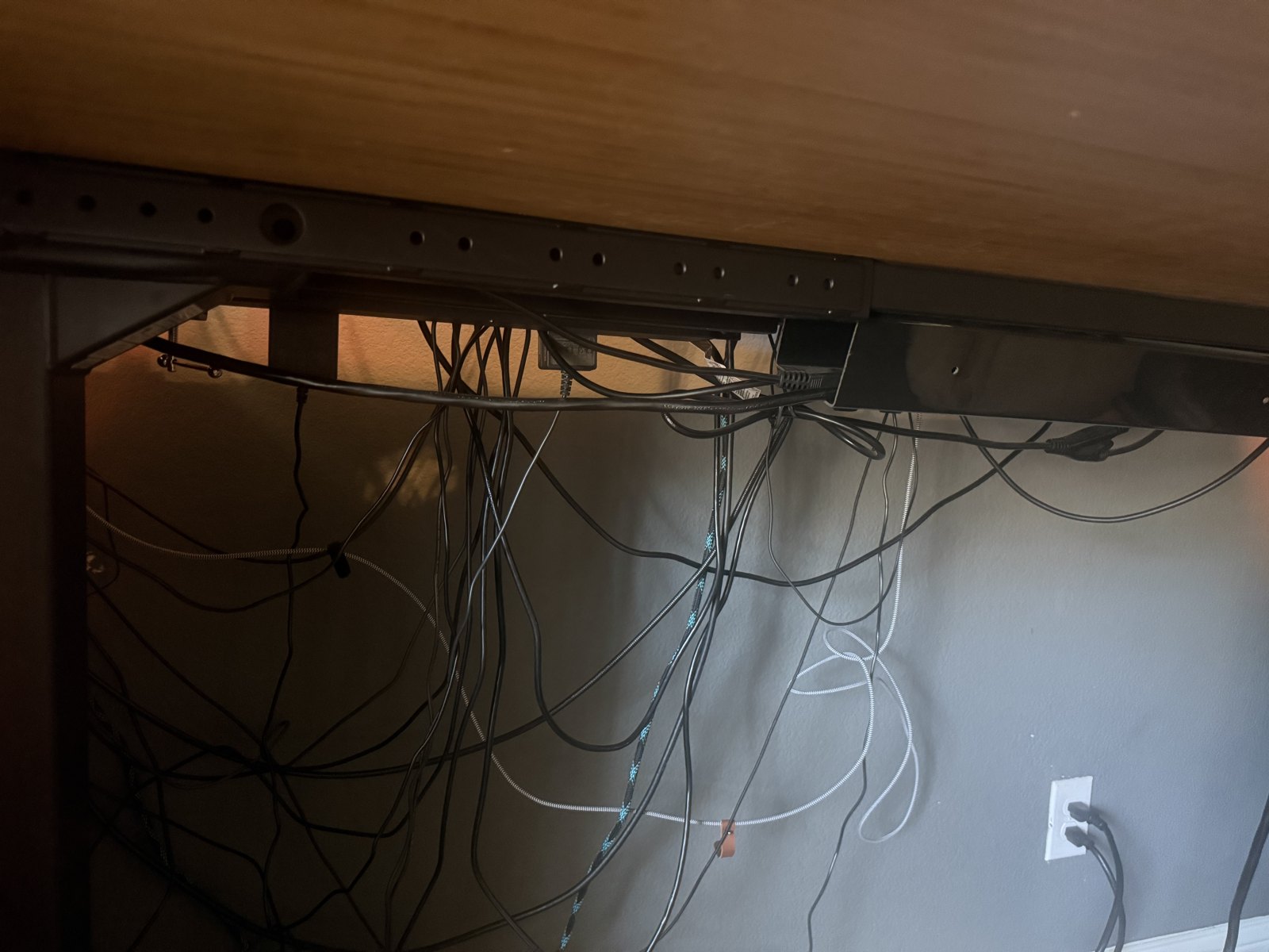 Underneath: the crossbar, the mounting rail, and the cable tray. Also my cable management, which is the one part of this setup nobody should copy.