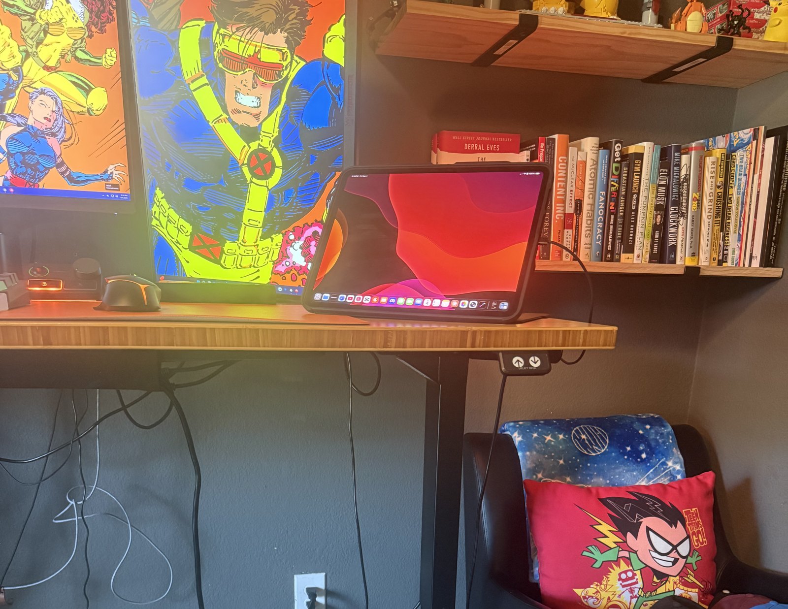 The V3 up at working height. Bamboo top, the frame doing the work underneath, and the keypad on the right edge where my thumb finds it without looking.