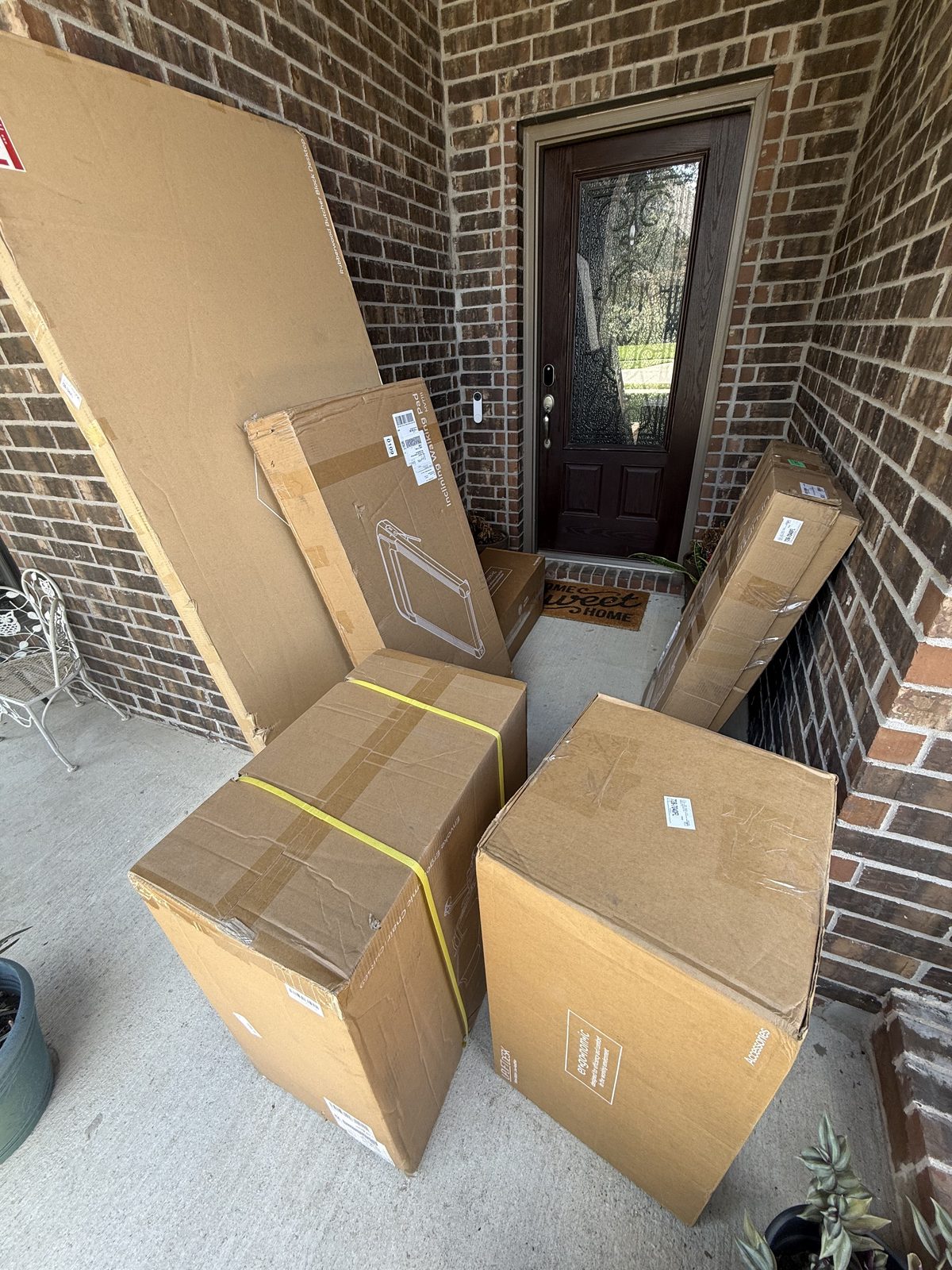 Eight UPLIFT boxes stacked in my office on delivery day