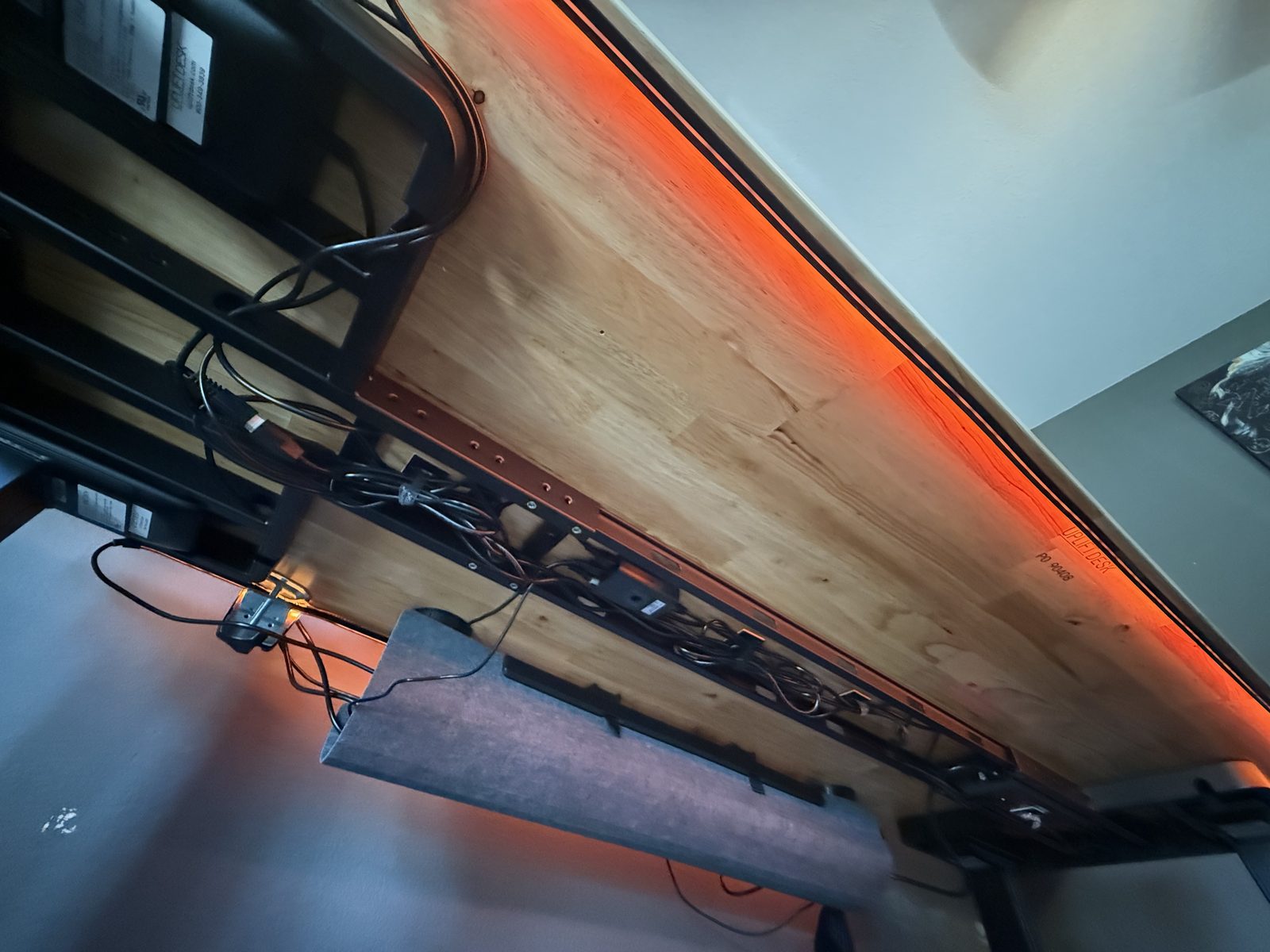The cable tray under the new desk with everything routed