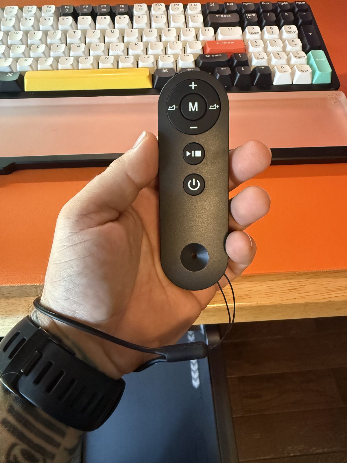 Close up of the walking pad remote buttons in hand