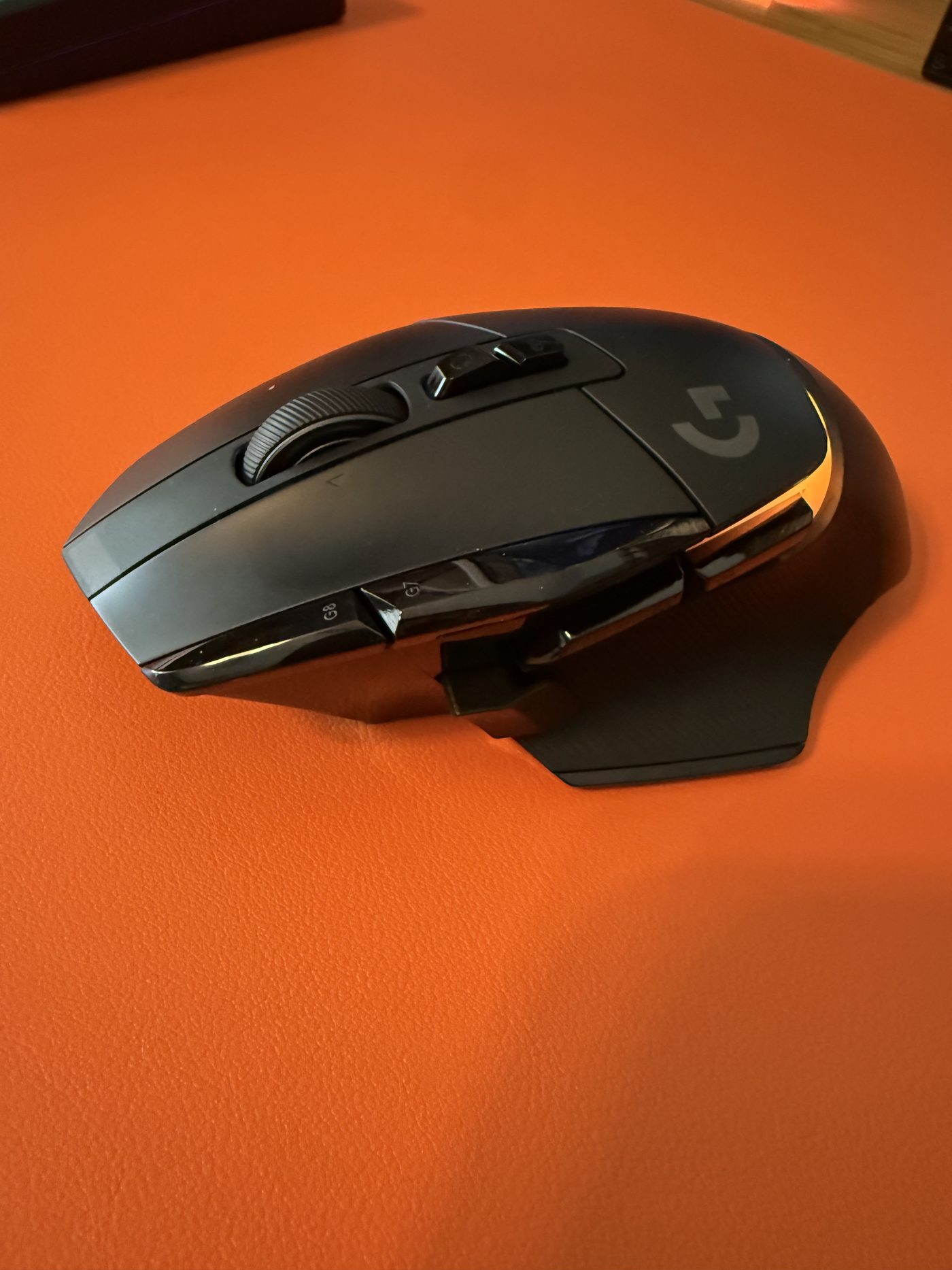 Side profile: the thumb buttons and dual-mode wheel that run half my workday