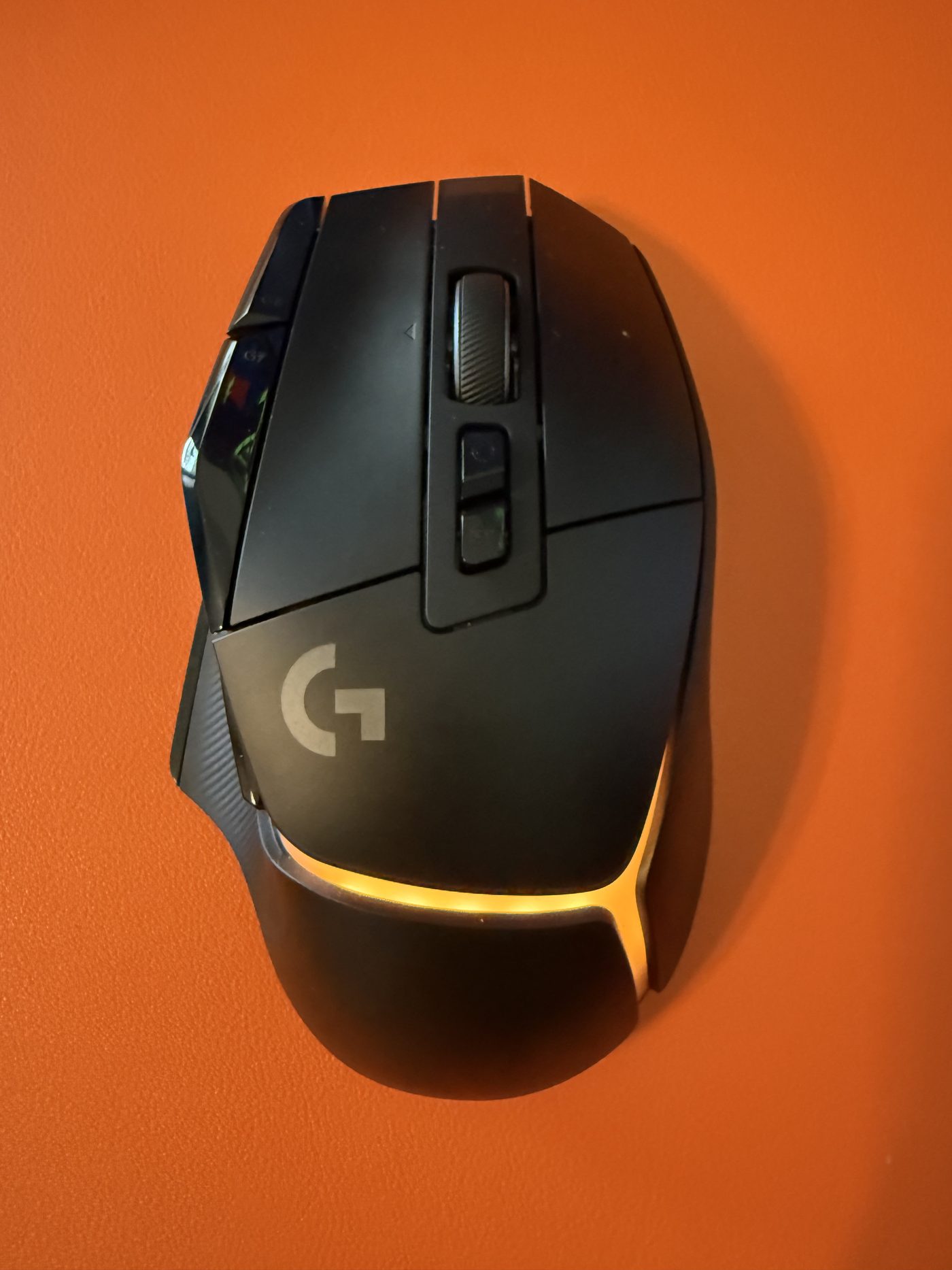 The G502 X Plus. The orange glow matching the deskmat was not an accident